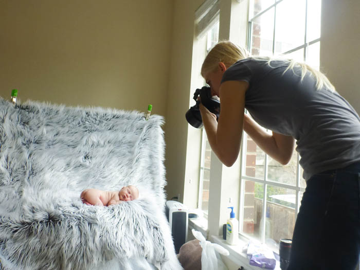 Capturing the baby next to a window with natural light